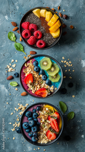 Assorted fruits with granola on acai bowls - A variety of fresh fruits and granola served on vibrant acai bowls for a healthy, colorful breakfast or snack
