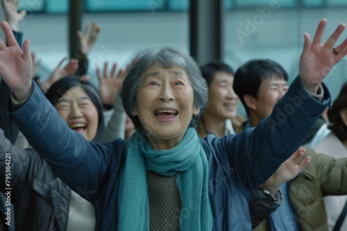 Asian senior or elderly old lady woman happy and excited with crowd of people in the background at the airport.