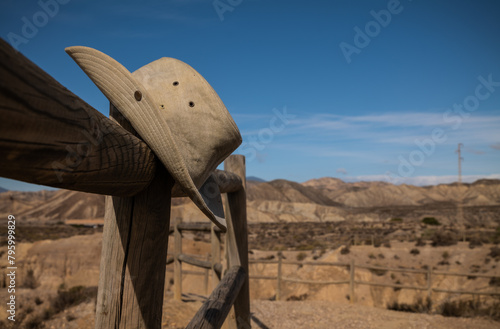 Closeup of cowboy hat on desert