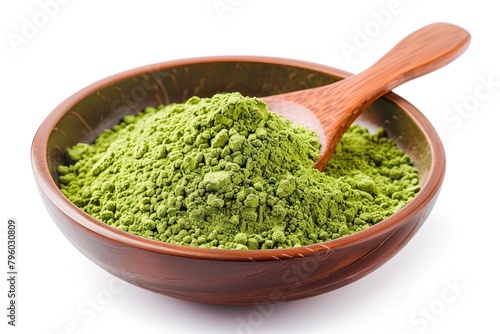 Wooden spoon with powdered matcha green tea in bowl, isolated on white 