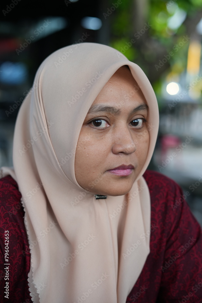Portrait of a woman wearing a hijab in a cafe Portrait of a woman wearing a hijab in a cafe