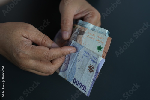 Rupiah banknotes being counted