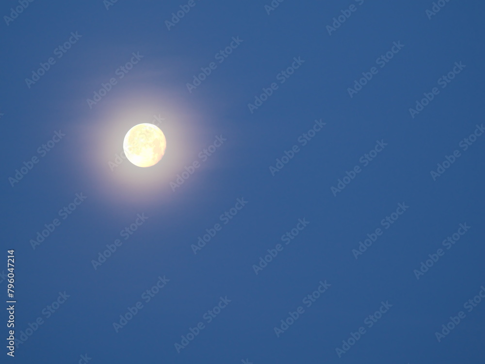 Tokyo, Japan - April 26, 2024: The moon on obscured sky at night