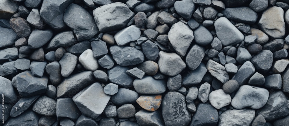 A stack of cobblestone rocks forms a natural art piece on the beach A stack of cobblestone rocks forms a natural art piece on the beach