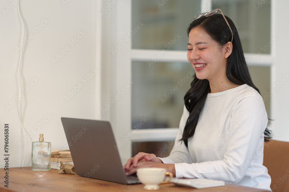 Confident businesswoman using laptop at work Female freelancer connects to internet via computer Bloggers or journalists write new articles, chat online.