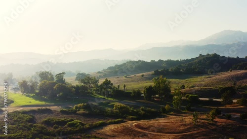 4k Drone footage of a beautiful mountain landscape in California. Sunset light falls on the hills of a nature preserve in Ventura County. Ojai Valley. Shore of Lake Casitas. USA