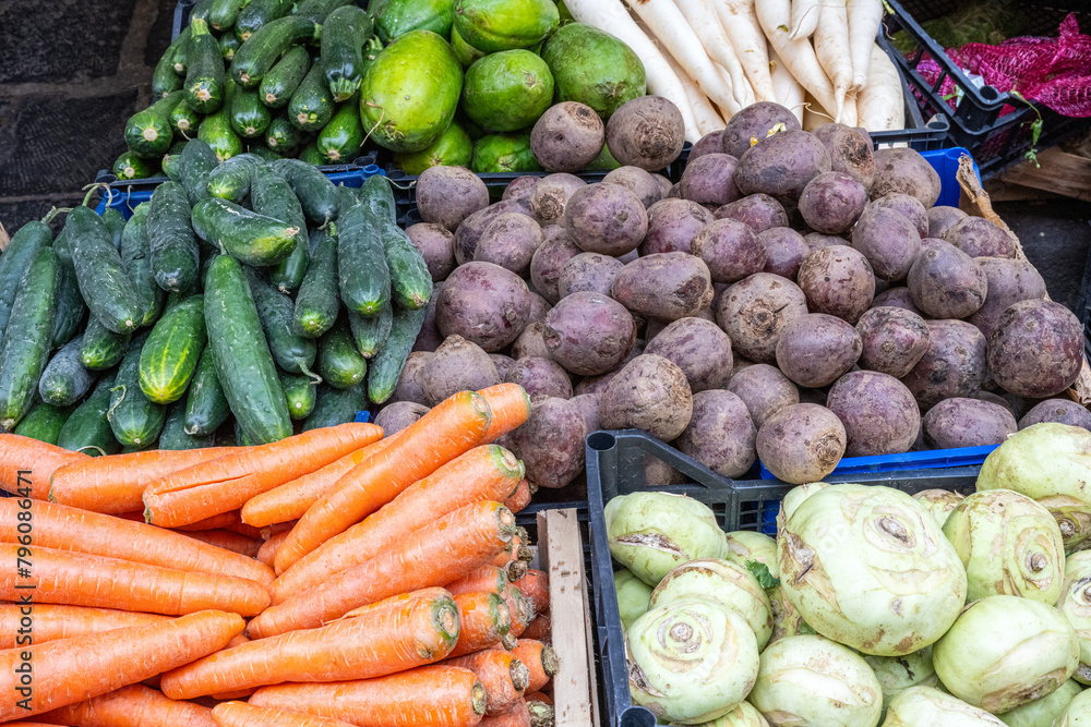 Carrots, celeriac and beetroot for sale at a market Carrots, celeriac and beetroot for sale at a market