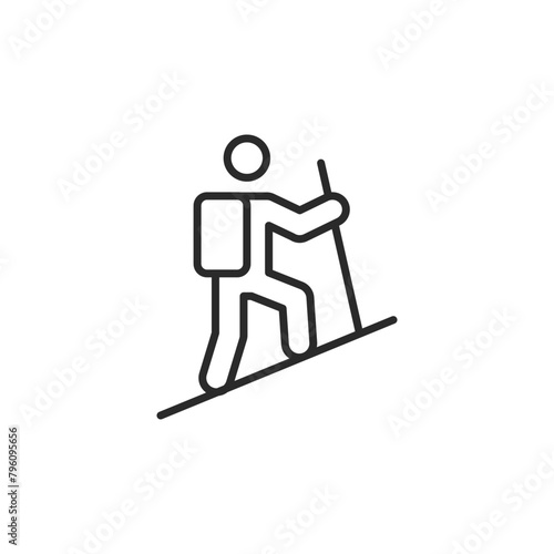 Hiking icon. Simple illustration of a hiker with a backpack using a walking stick on a slope, representing adventure and outdoor activities. A great symbol for apps. Vector illustration 