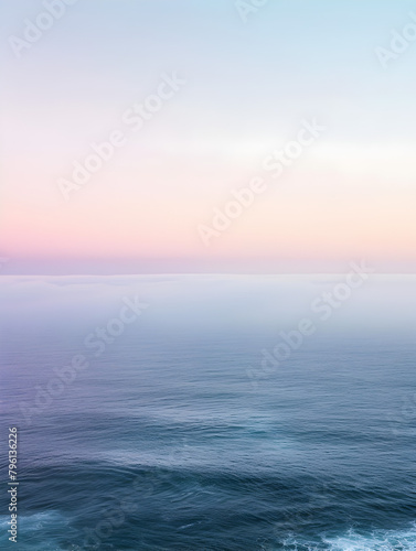 A beautiful ocean view with a pink and purple sky. The sky is a mix of colors, and the water is calm. Concept of peace and tranquility
