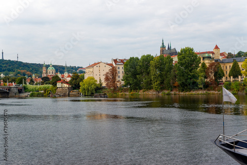 Scenic view of Moldova River with famous castle and cathedral of Czech City of Prague on a cloudy autumn day. Photo taken October 10th, 2023, Prague, Czechia.