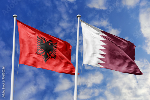 3d illustration. Albania and Qatar Flag waving in sky. High detailed waving flag. 3D render. Waving in sky. Flags fluttered in the cloudy sky. photo