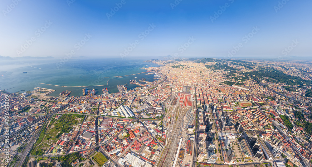 Naples, Italy. Train station - Napoli Centrale. Neapolitan Bay with ships. Panorama of the city on a summer day. Sunny weather. Aerial view