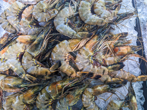 Fresh tiger prawns on ice in seafood market, Indonesia.