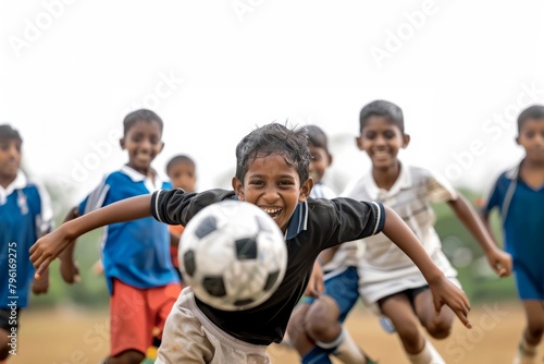 indian children playing soccer together at summer camp © Ingenious Buddy 