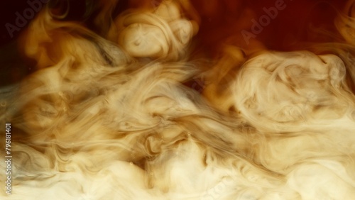 Detail of milk mixing in coffee drink, flat texture. © Jag_cz