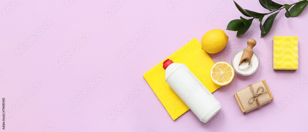 Soda with lemon, bottle of detergent and cleaning supplies on lilac background with space for text