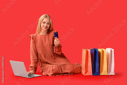 Young woman with modern lap...