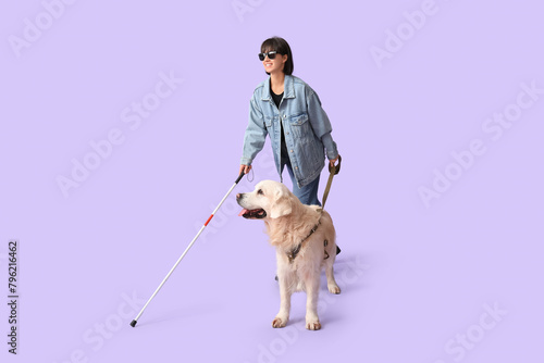 Blind woman with guide dog on lilac background