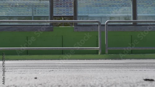 Formula cars racing blur at motorsport track side view from pit lane, original engine sound