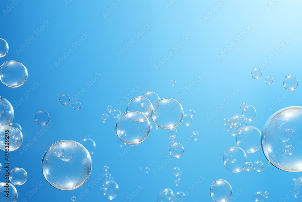 Soap bubbles on a blue background, copy space.
