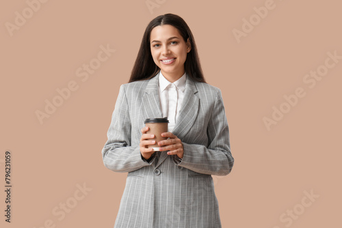 Pretty businesswoman with c...