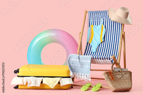 Suitcase with clothes, beac...