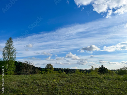 Beautiful landscape. Summer. Sky with clouds. Walk.

