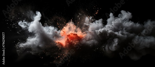Explosion of red and white powder on a dark backdrop