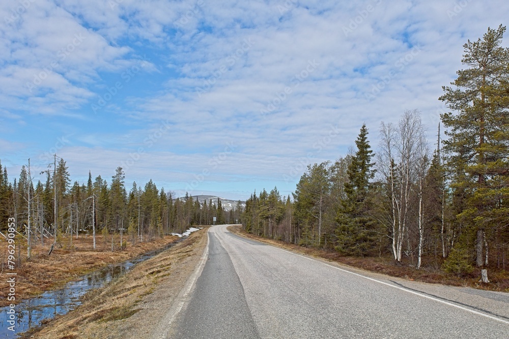 Pyhä-luostontie road in cloudy spring weather, Lapland, Finland. Pyhä-luostontie road in cloudy spring weather, Lapland, Finland.