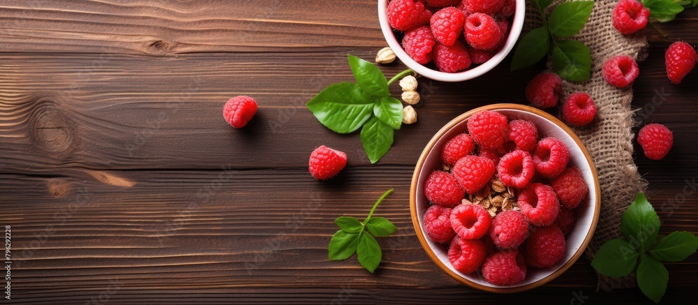 Raspberries in bowls on a wooden table Raspberries in bowls on a wooden table