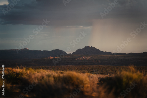 Sunset from Wahweap point in the town of Page, Arizona, with rain clouds in the background photo