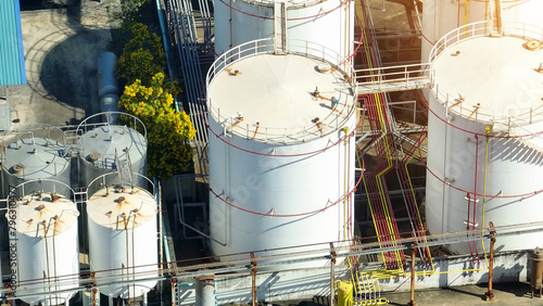 A diesel and biodiesel refinery processes petroleum and organic materials to produce eco-friendly fuels for transportation. Petroleum and crude oil concept. Aerial view drone.
