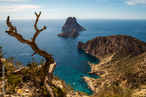 Beautiful view of Es Vedra island and small coves from the top of a cliff, Sant Josep de Sa Talaia, Ibiza, Balearic Islands, Spain