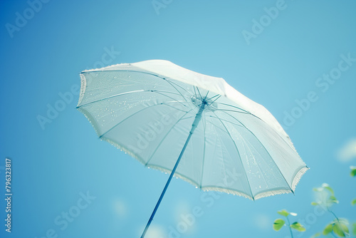 white umbrella on sky background