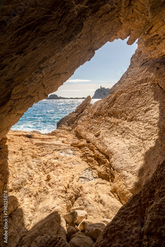 The inclined cave, Punta Grossa cape, Cala de Sant Vicent cove, Sant Joan de Labritja, Ibiza, Balearic Islands, Spain photo