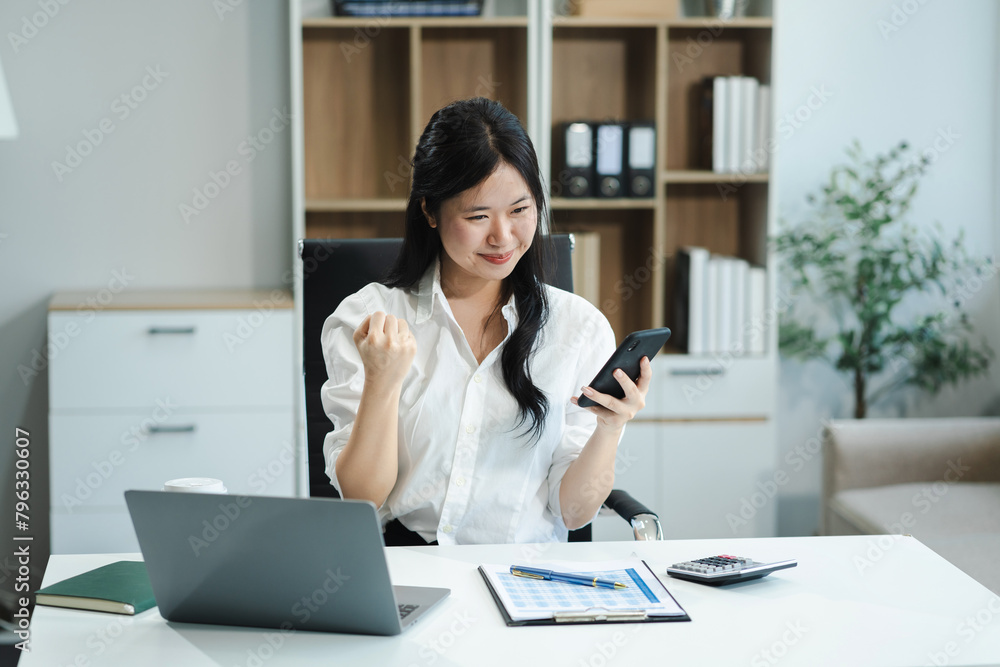 Happy excited smartphone user enjoying, success, achieve, high job result. Euphoric businesswoman using cellphone, reading text message. Happy excited smartphone user enjoying, success, achieve, high job result. Euphoric businesswoman using cellphone, reading text message.