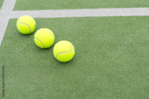 Tennis ball on green grass © Angelov