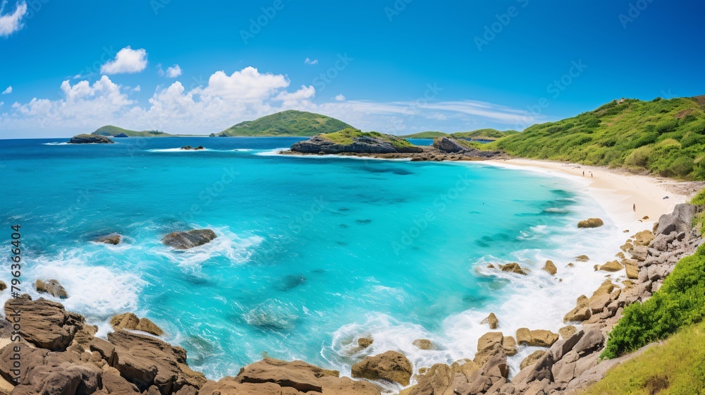 Fototapeta premium a blue water with rocks and a sandy beach