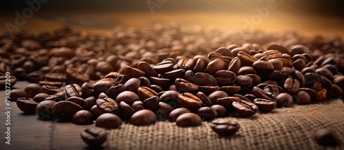 Coffee beans close up on wooden table © HN Works