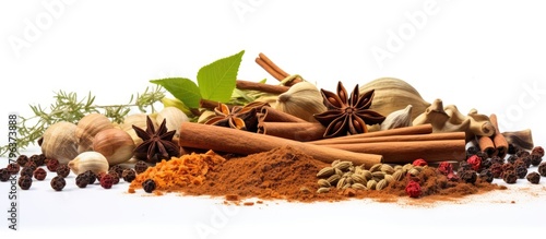 Various herbs and spices arranged on a white surface photo