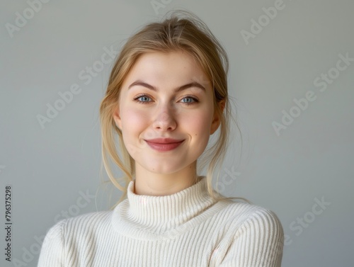 Beautiful blonde caucasian young woman girl portrait studio photo smiling at camera with healthy teeth toothy smile