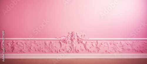 Pink wallpaper on wall with white mold photo