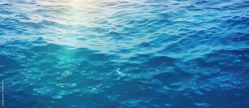 Obraz premium Blue ocean with sunlight and waves