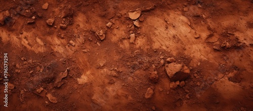 Dirt surface close-up with rocks and soil photo
