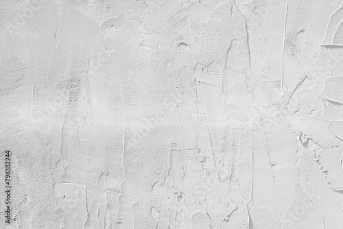 Rough white abstract background with random shapes, shadows and textures. White wall with space for text.