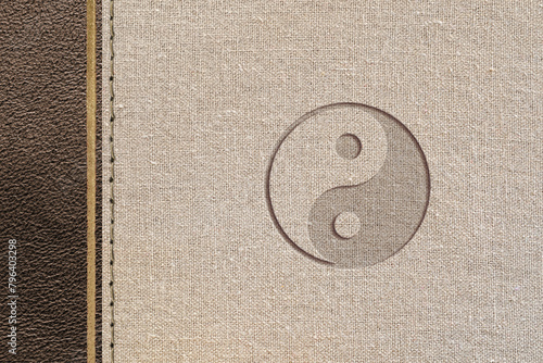 Taoist philosophy design with leather and fabric with yin-yang engraved