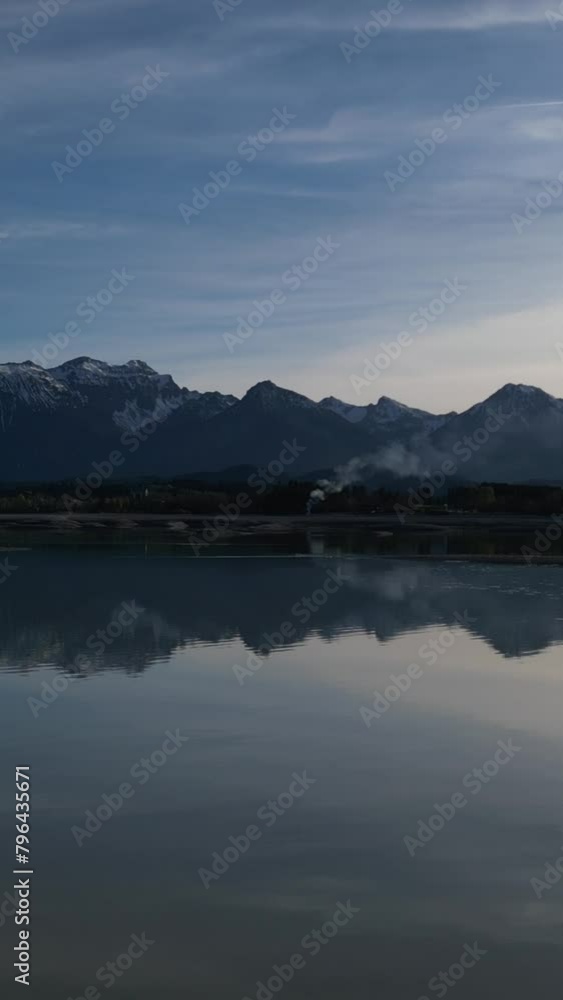 The Bavarian Forggensee at the Allgäu area during the dry out phase and partly reflection The Bavarian Forggensee at the Allgäu area during the dry out phase and partly reflection