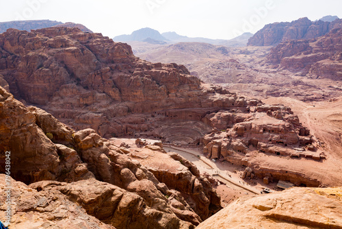 A view from above of the valley of the archeological site of Petra in Jordan with a view of the Nabatean Theatre