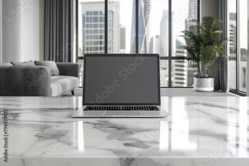 Modern workplace with an open laptop on a white marble table  mock-up  template