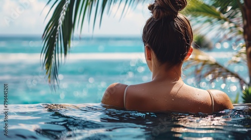 woman in pool on summer vacation © Vlad Kapusta